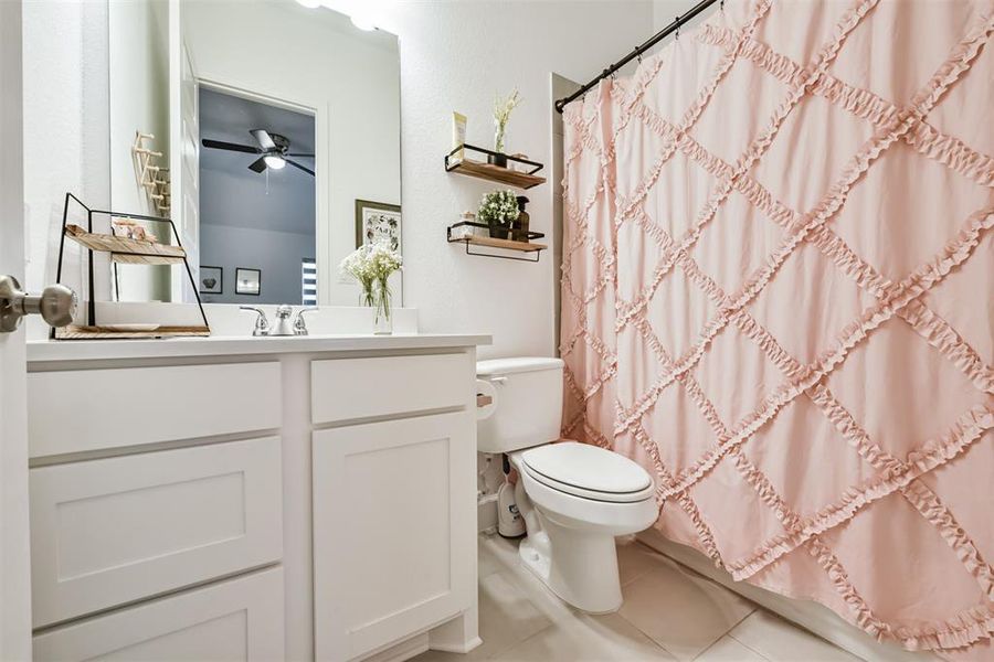 Secondary bathroom features atub/shower combo and vanitywith plenty of counter space.