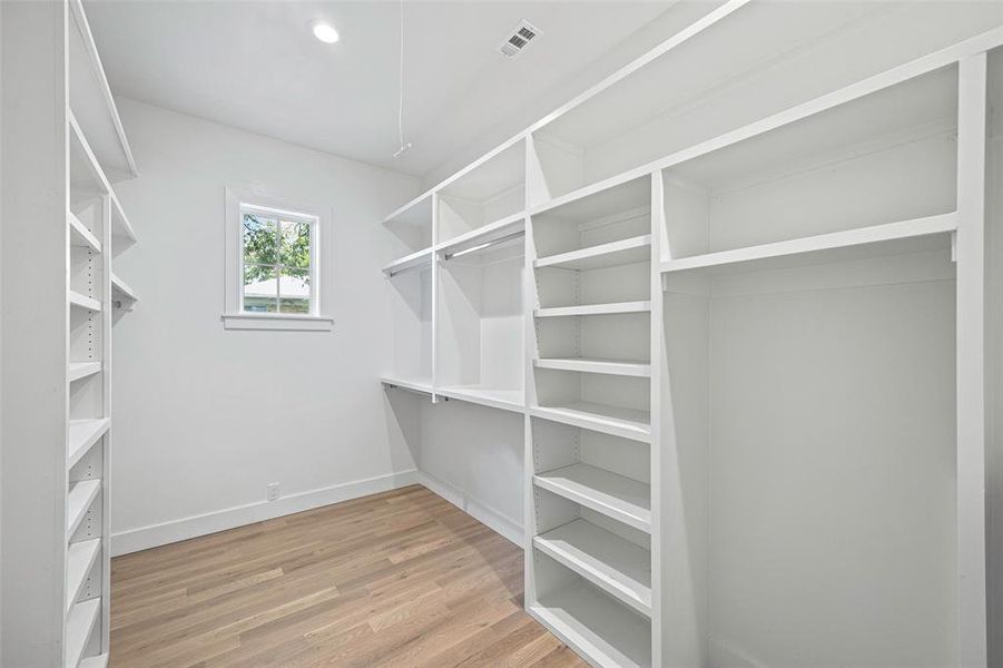 Walk in closet featuring hardwood / wood-style floors