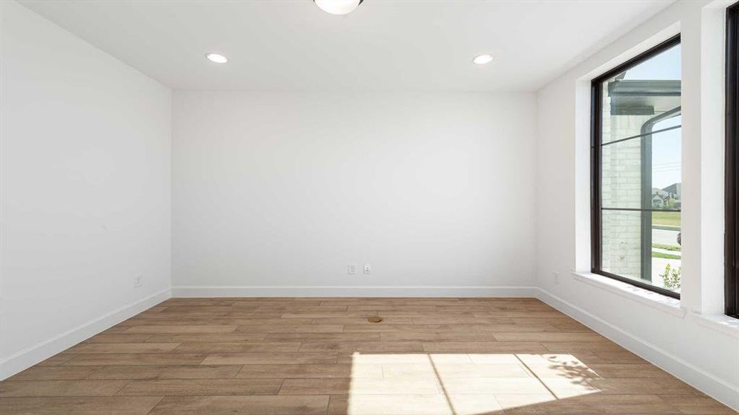 Spare room featuring light hardwood / wood-style flooring