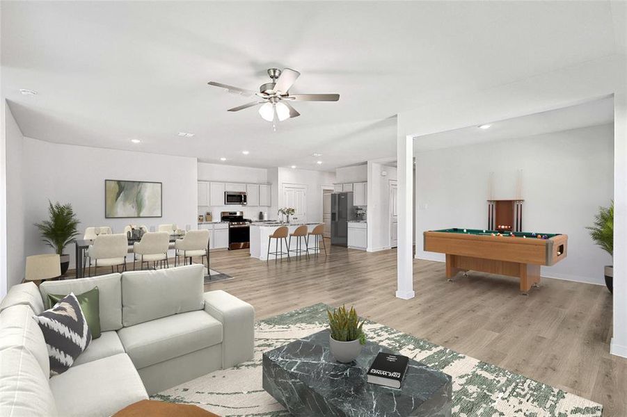 Living room with pool table, light hardwood / wood-style flooring, and ceiling fan