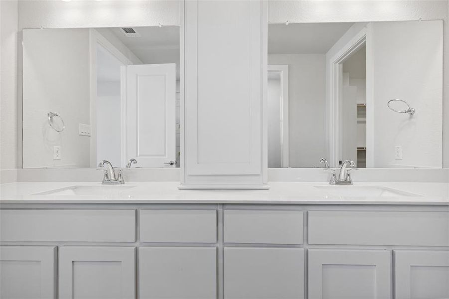 Bathroom with oversized vanity and dual sinks