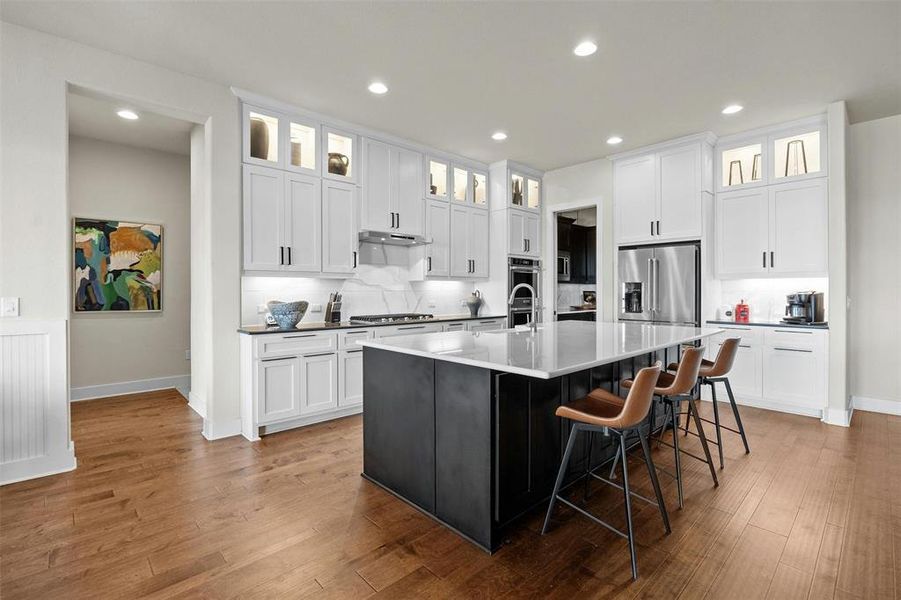 Masterful kitchen designed with tons of built in storage and large walk-in/working pantry.