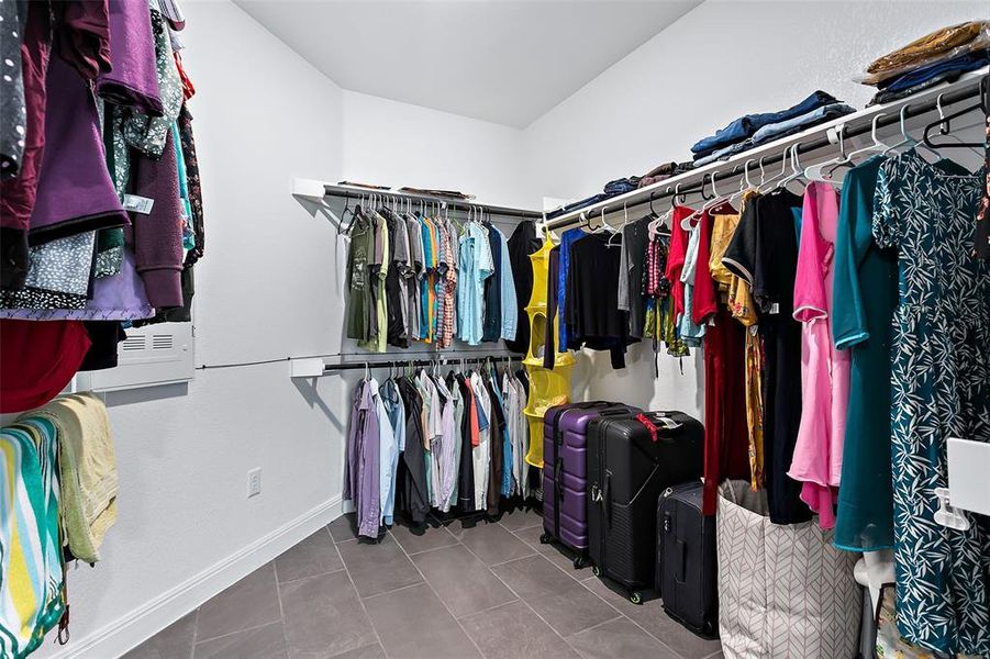 The primary closet is huge and has direct access into the utility room.