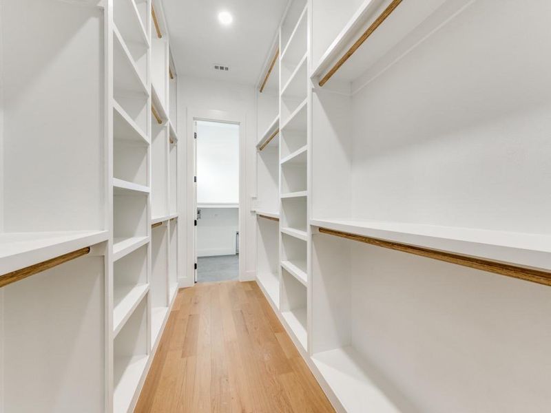 Spacious closet featuring wood-type flooring