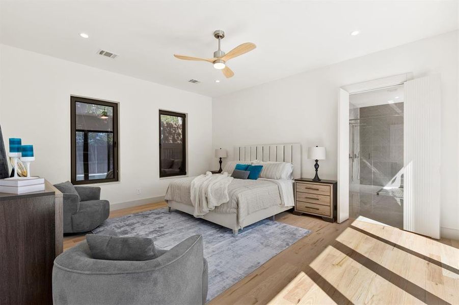 Bedroom featuring ceiling fan and light wood-type flooring