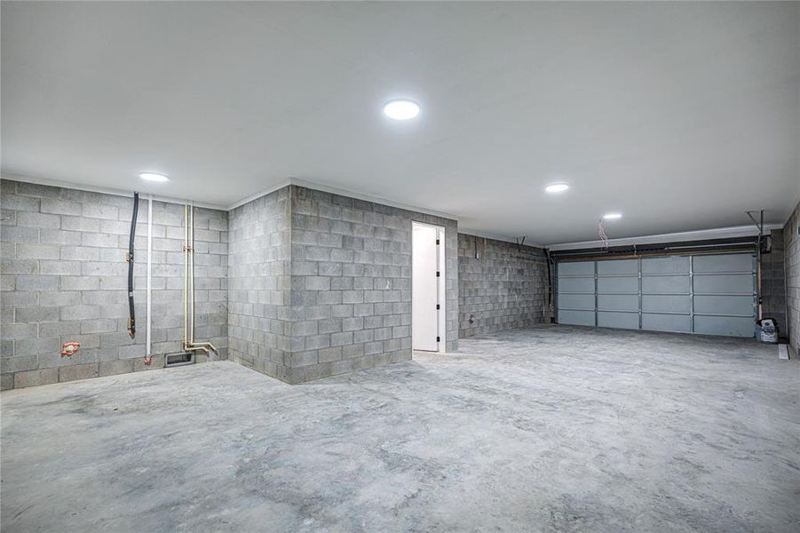 Oversized 3 car garage with lots of storage space