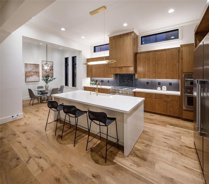 Fully equipped gourmet kitchen with large center island and engineered French Oak hardwood floors