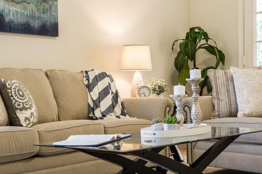 The spacious living room is open to the dining area and the kitchen.