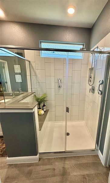 Bathroom with a shower with door