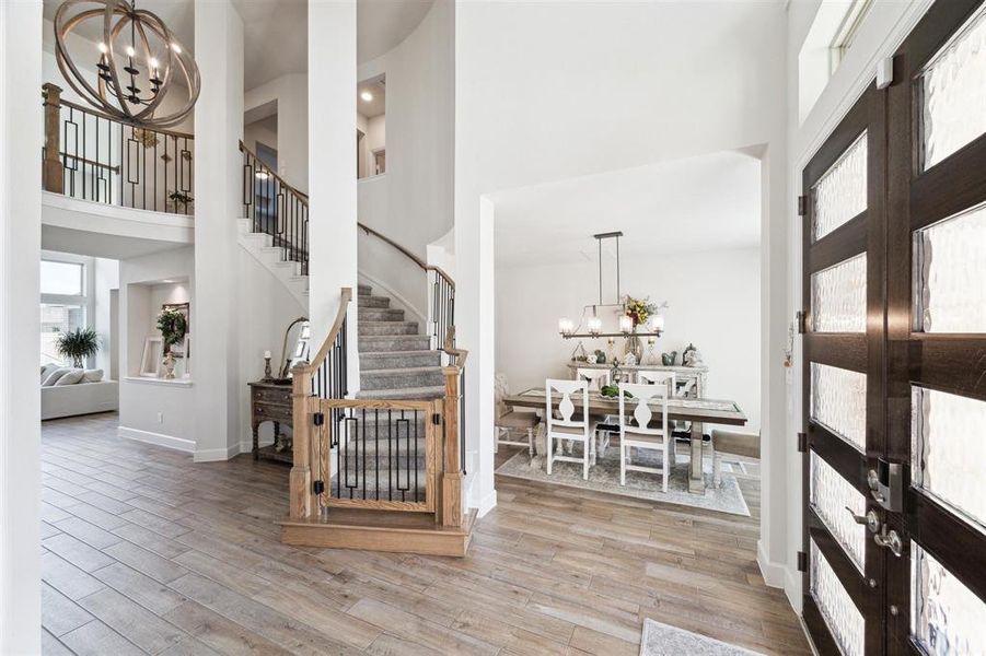 The entry provides access to the curved staircase that leads to upper level bedrooms, gameroom and media room. The stair case has a custom safety gate that matches the stair railings and handrail.