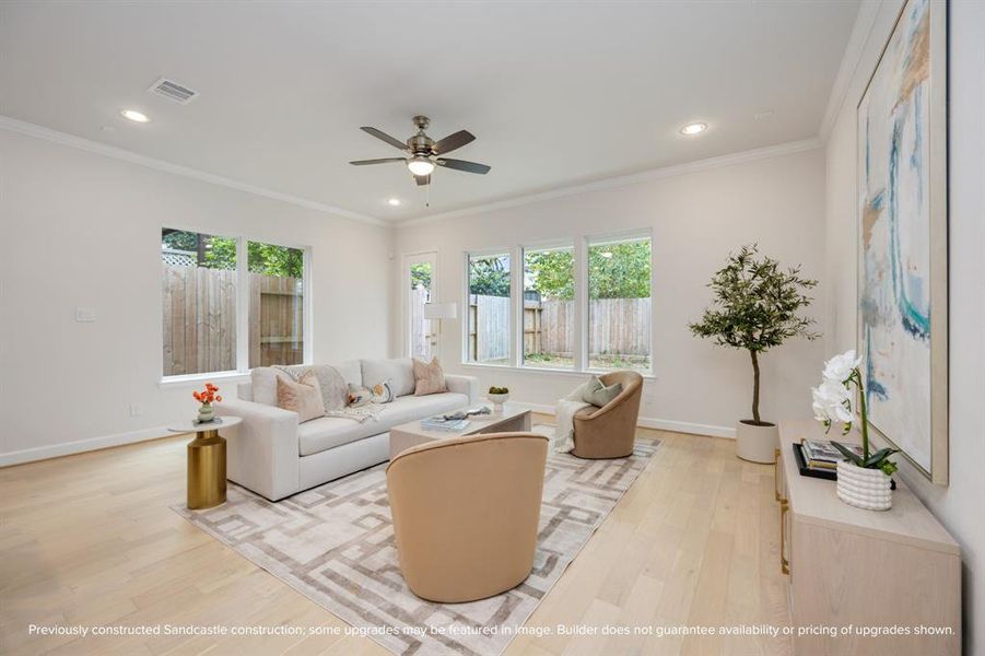 Bask in the warmth of the living room, where neutral light walls and exquisite light wood floors craft an ambiance of understated elegance.