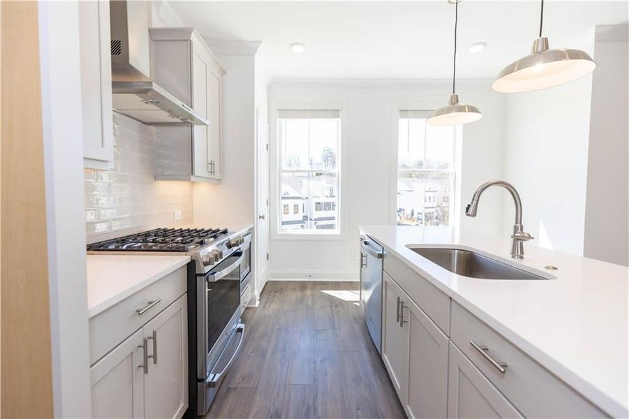 Natural light fills the kitchen.**Photos of model house and not of actual home - Photos for representation purposes only **