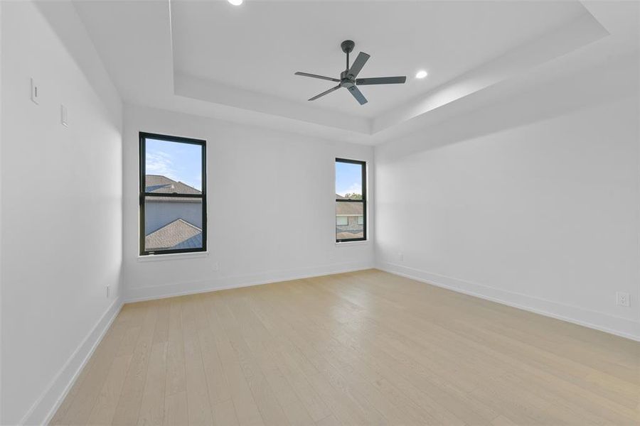 Each secondary bedroom is appointed with white oak floors custom ceiling treatments and a walk-in closet.