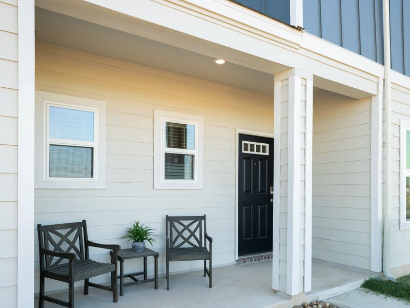 The front door is located on the side of the home, allowing for privacy.