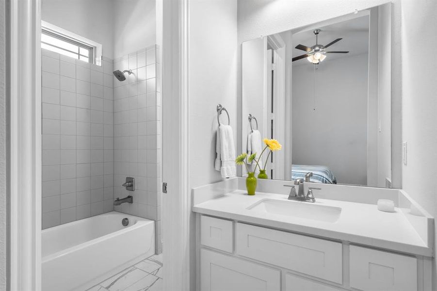 3rd Full Bathroom with tiled shower / bath combo and vanity