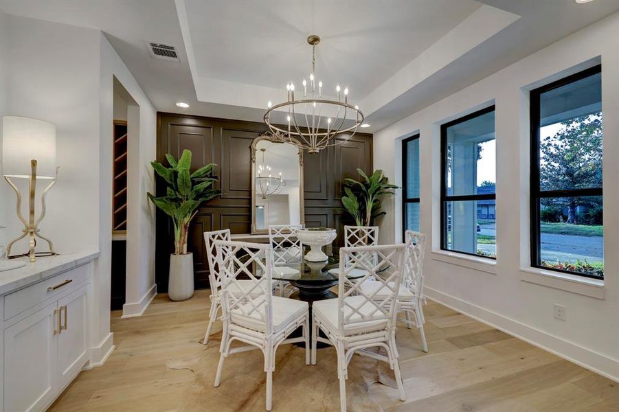 Formal dining room with accent wall*photos of a previously constructed home by the builder, and are not meant to represent 1252 Cheshire exactly. Seller reserves the right to modify finishes at their sole discretion.