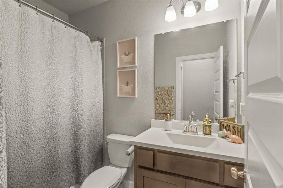 Bathroom with vanity and toilet