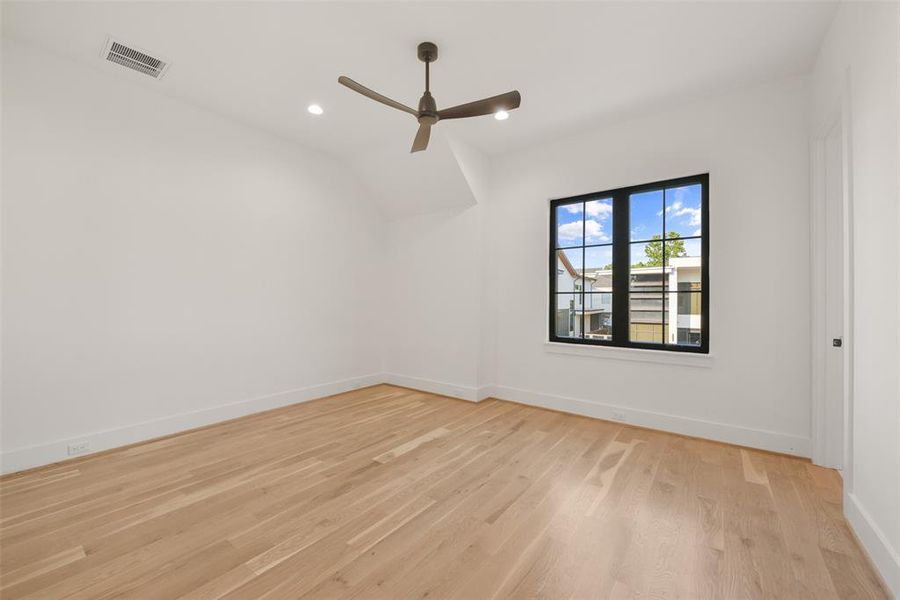 One of three secondary bedrooms on the second floor. each features an ensuite bath and walk-in closet.