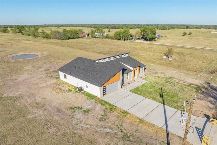 Birds eye view of property with a rural view