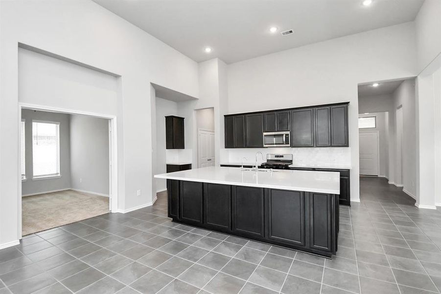 Entertaining is a breeze in this home's kitchen, as it overlooks the family room, allowing you to effortlessly participate in conversations and socializing