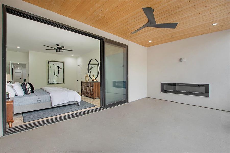 Bedroom featuring ceiling fan and wooden ceiling