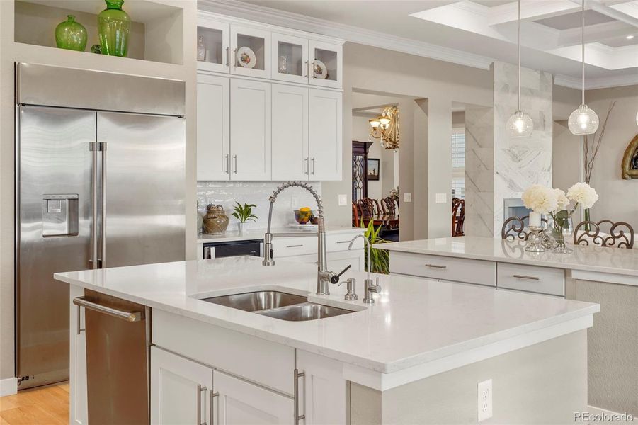 Don't miss the stunning coffered ceiling of the family room and kitchen transition. Such a pretty and elevated architectural detail!