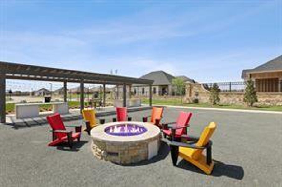 View of property's community with a fire pit