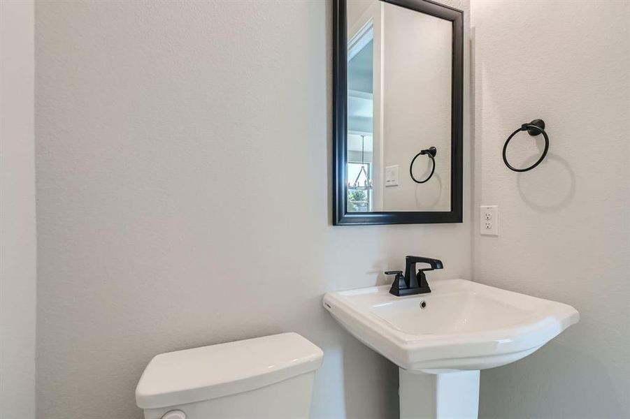 Bathroom featuring toilet and sink