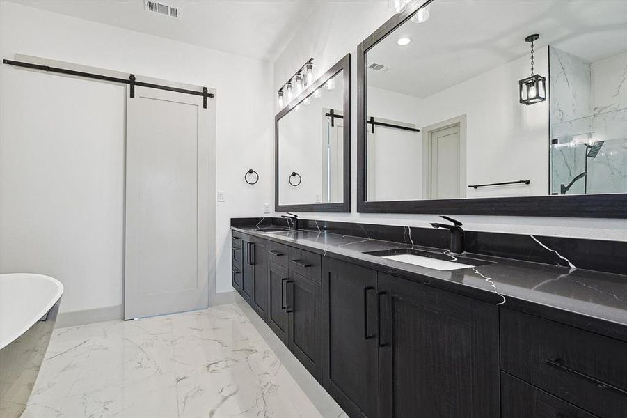 Bathroom featuring vanity and plus walk in shower