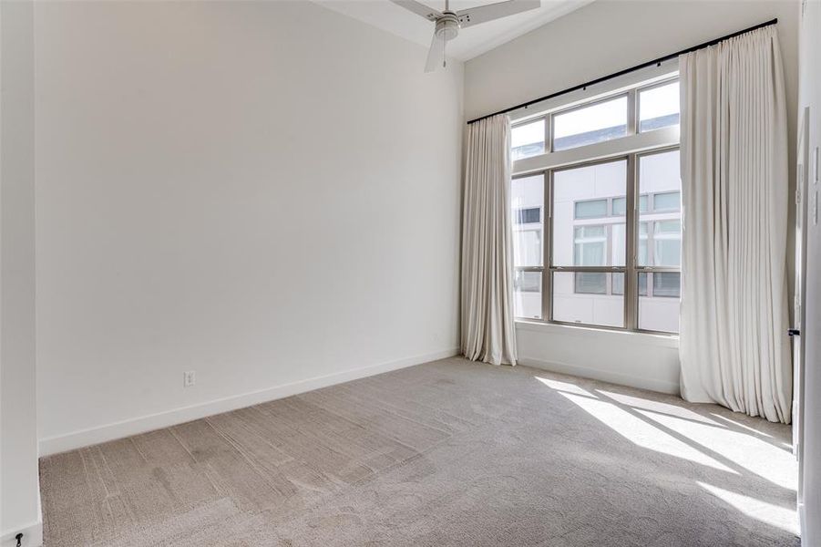 Primary Bedroom with LOTS of Natural Light, Vaulted Ceiling, and Large Walk in Closet