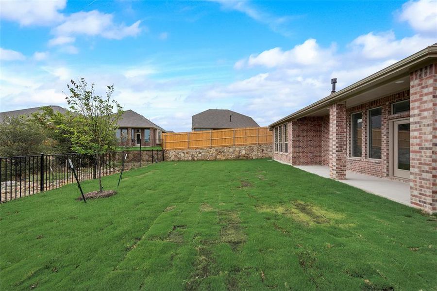 View of yard with a patio