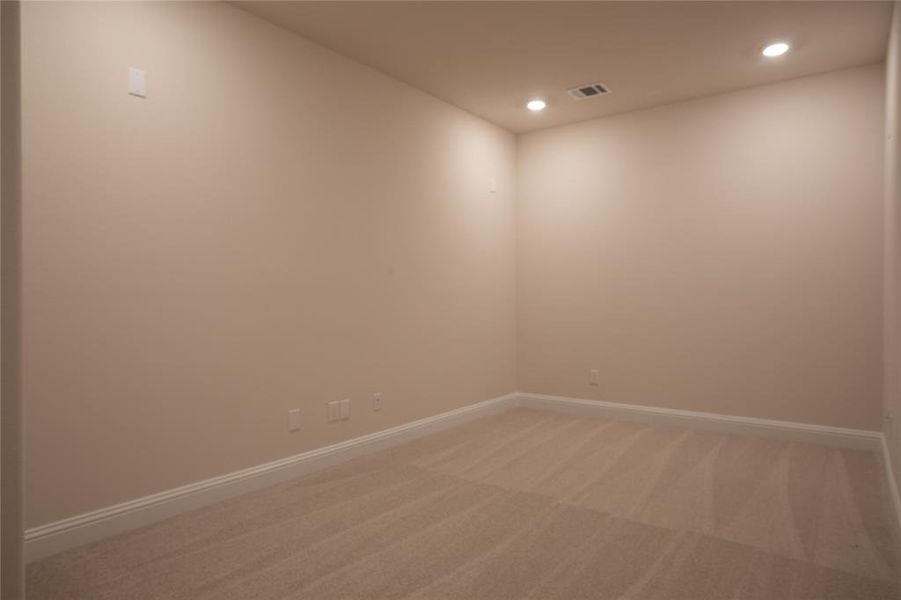 Unfurnished room with carpet