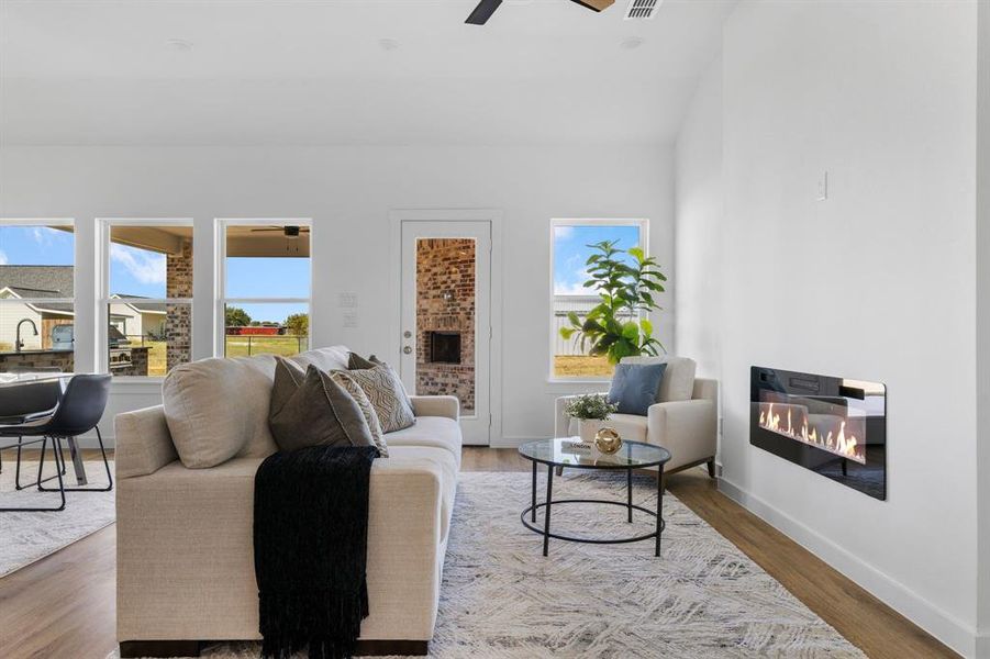 Living room featuring hardwood / wood-style floors and ceiling fan