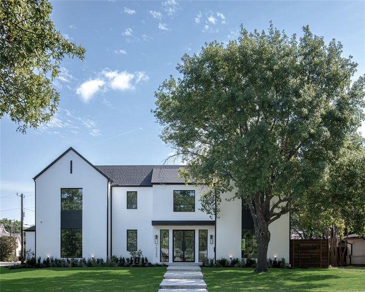 View of front of property with a front yard