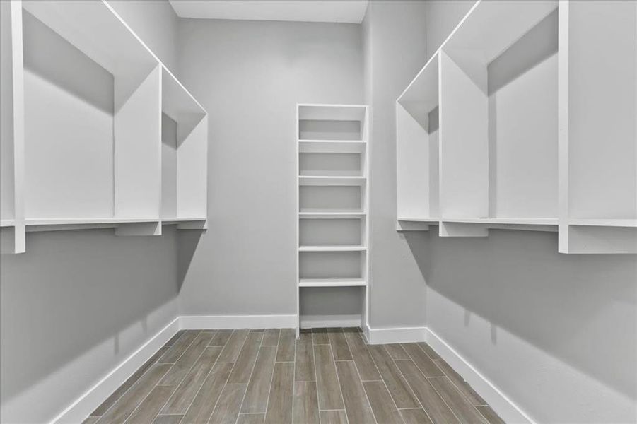 The master bedroom has dual walk in closets.