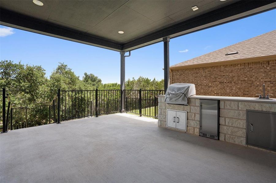 Extended and upgraded back patio w/ outdoor kitchen