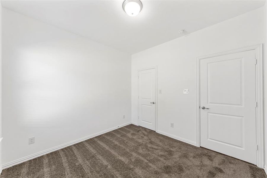 View of carpeted spare room