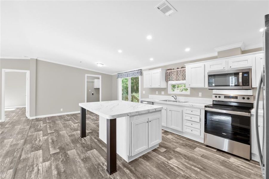 Kitchen w/ view of Dinette, Primary Bedroom & Laundry Room Entrance