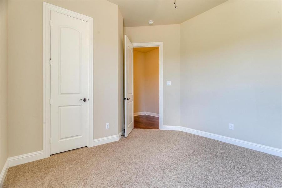 Unfurnished bedroom featuring carpet flooring