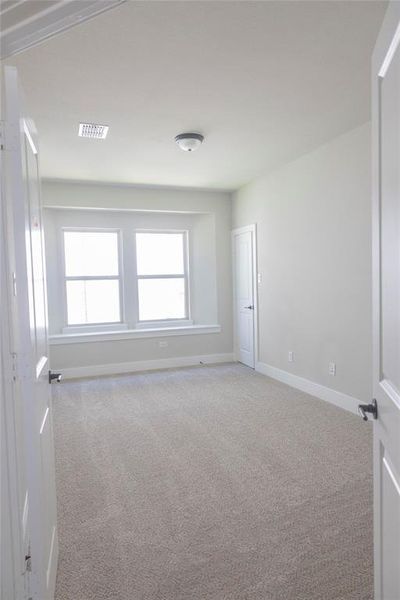 Unfurnished room with carpet flooring