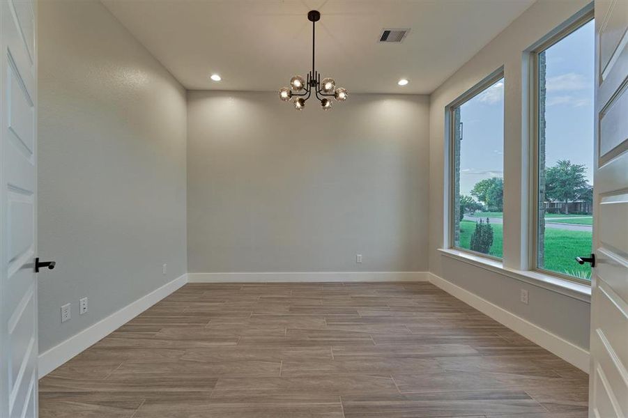 The home office has double doors for privacy with large windows overlooking the front yard. This flexible space can also be a formal dining room, exercise room or play room. Utilize this space how you see fit!