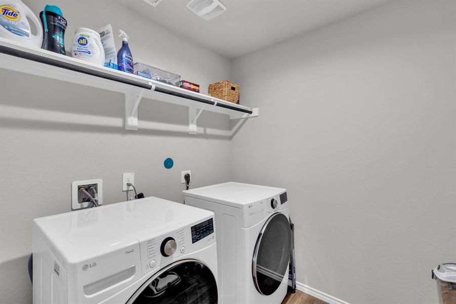 Spacious laundry room offering ample storage options, with room for shelving or cabinets to help keep essentials organized.