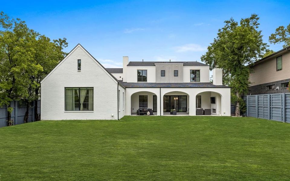 Back of house featuring a patio area and a yard