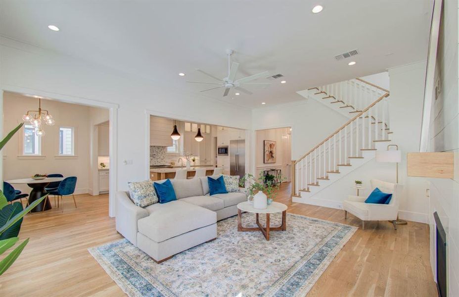 The room is filled with natural light. Enjoy the fireplace, French doors that spill out to the back deck.