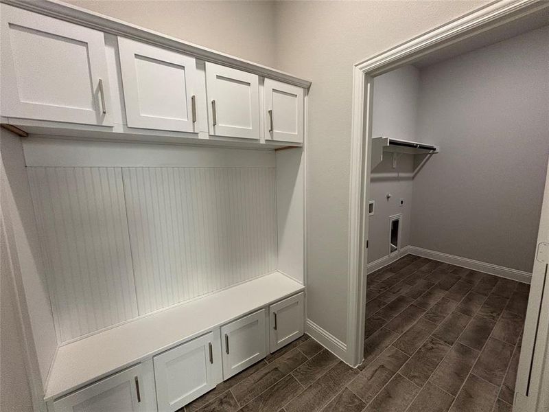 Mudroom with dark hardwood / wood-style flooring