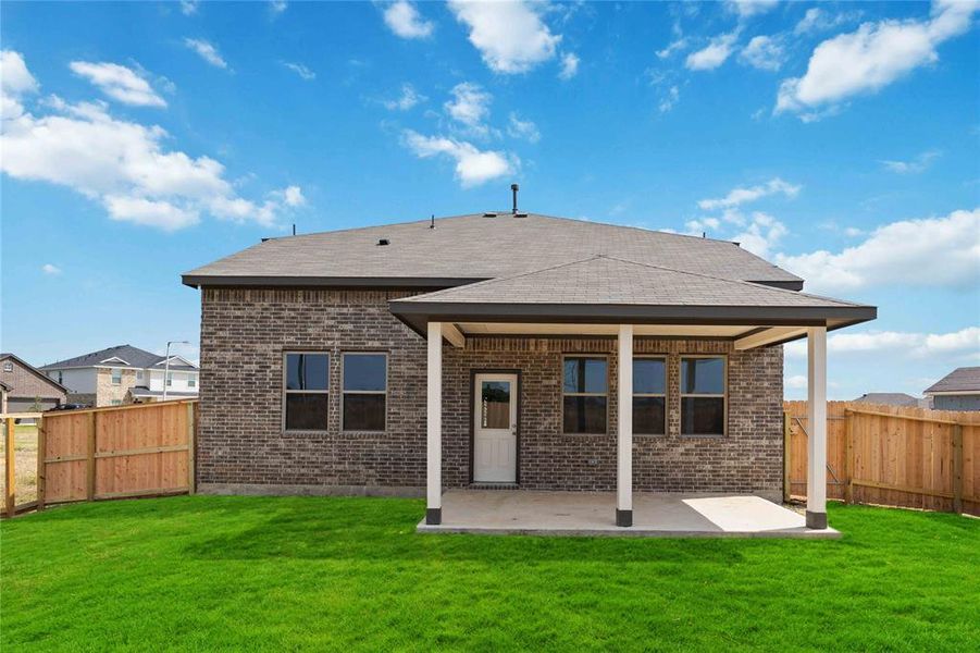 Experience outdoor living at its finest on this expansive covered patio, thoughtfully designed for BBQs and delightful outdoor dining.