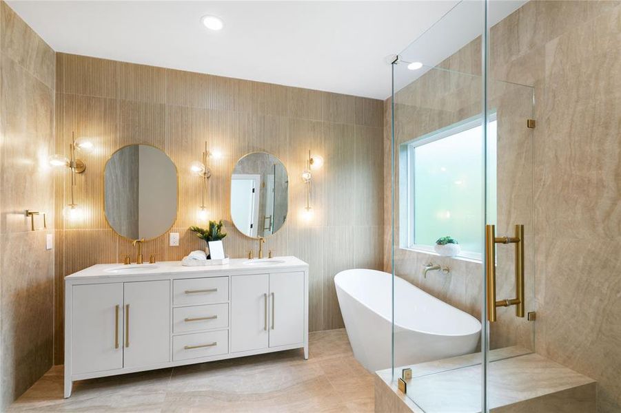 Stunning bathroom with double vanities, soaking tub and separate shower.