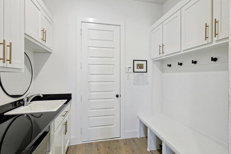 Large mudroom with sink and built-ins!