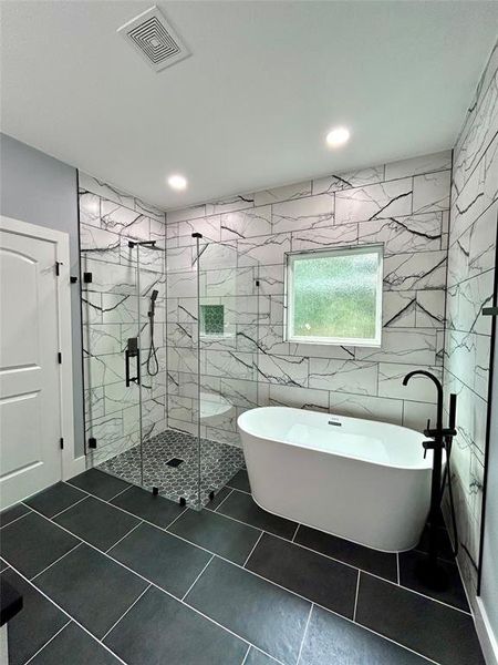 Separate shower/tub in the primary bathroom.