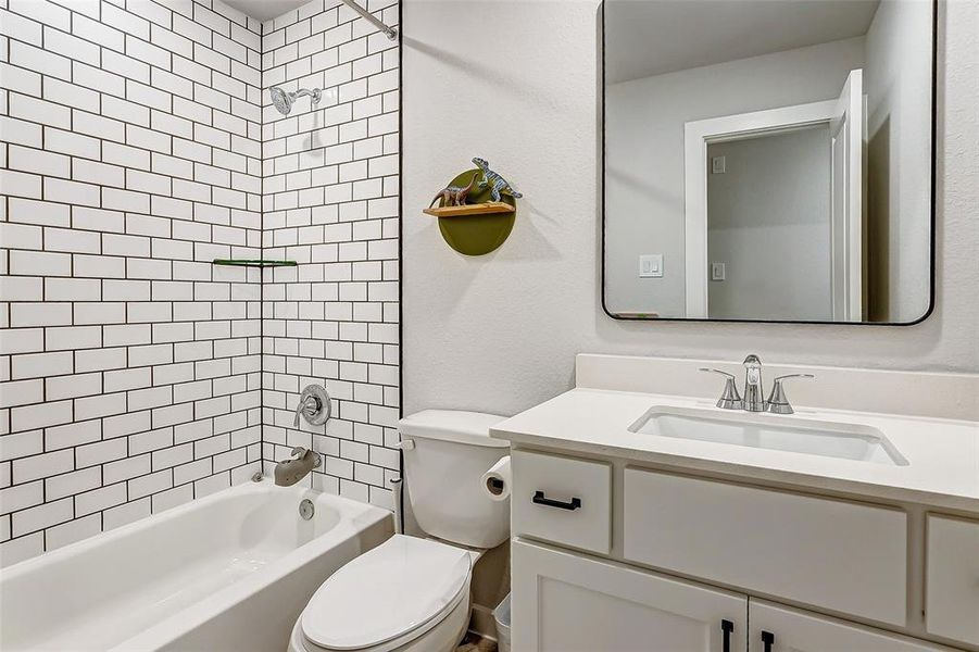 3rd full bathroom with custom mirrors, floor to ceiling tile, Schluter trim and beautiful cabinetry.